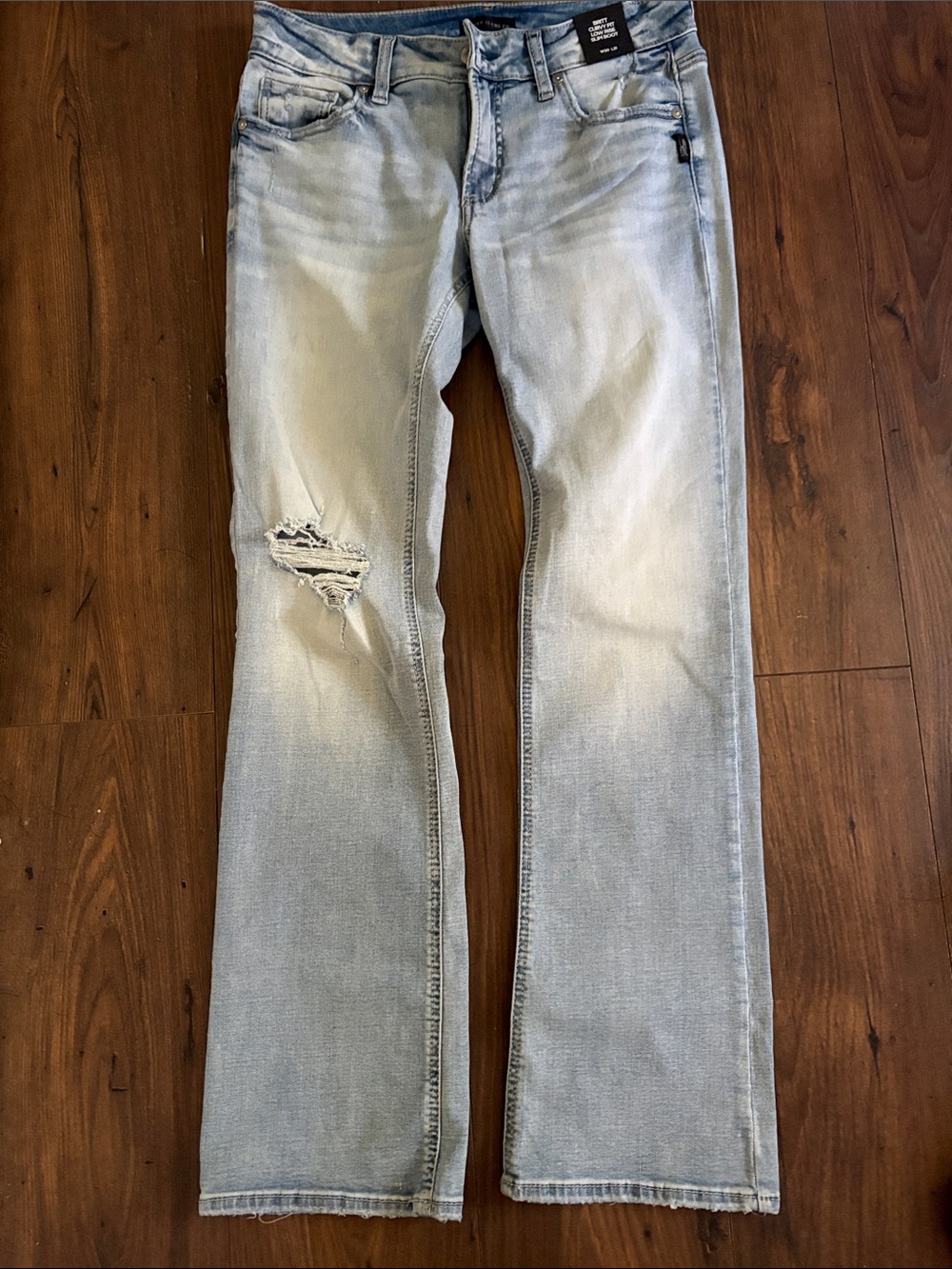 Silver Jeans Light Wash Bootcut Jeans with Knee Distress